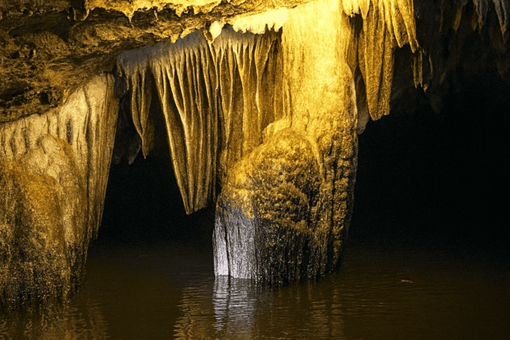 The path leading into Dark Cave is winding and narrow, with little to no natural light reaching inside, hence its name given by the locals